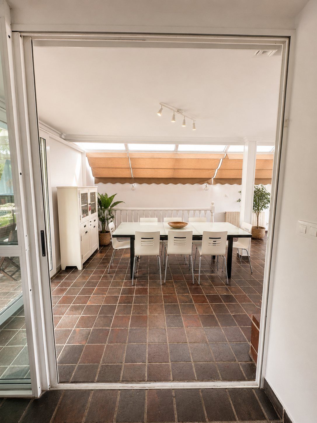 A glimpse through the doorway into the dining room and staircase.